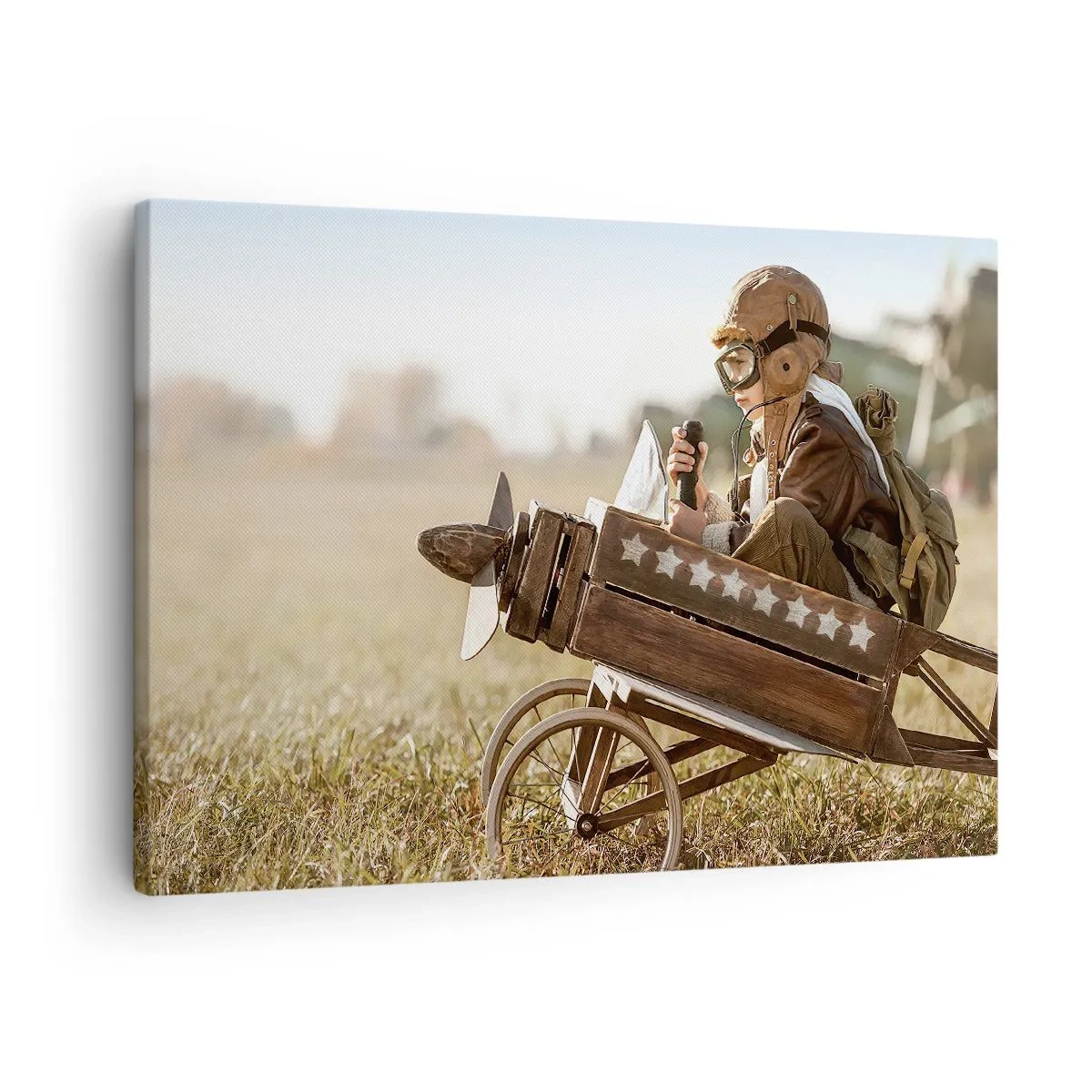 Obraz na plátně - Dítě v hračkovém letadle s polem v pozadí - 70x50cm - Start do snů - Moderní nástěnná dekorace do obývacího pokoje a ložnice ARTTOR